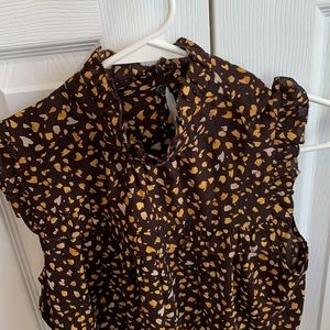 Ann Taylor sleeveless high-neck blouse.
